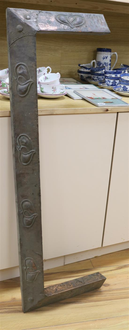 Two Art Nouveau copper panels, a similar fire curb, various brass finger plates and escutcheons